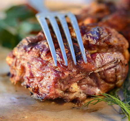 Fried meat on the wooden board.の写真素材