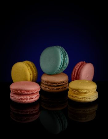 Tasty macaroos on blackの写真素材