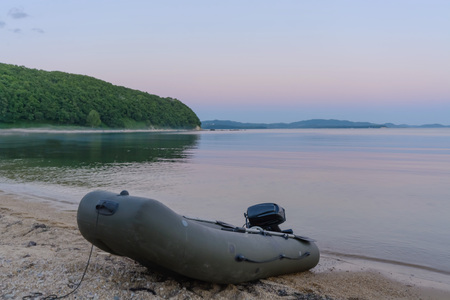 Empty inflatable boat on the coastの写真素材