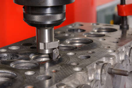 A machine for grinding car valves is being set up in the workshop.の写真素材