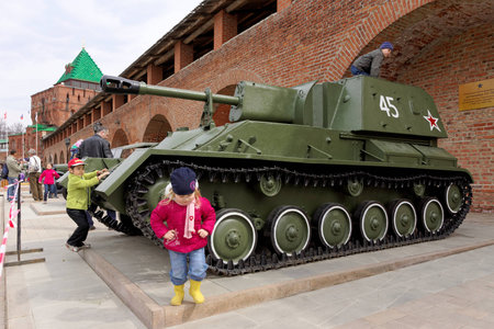 Children playing on the self-propelled artillery SU-76 at exhibition of military equipment of times of World War II in the Kremlin of Nizhny Novgorod.のeditorial素材