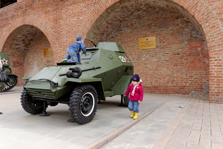 Children playing on the armored car BA-64 at exhibition of military equipment of times of World War II in the Kremlin of Nizhny Novgorod.のeditorial素材
