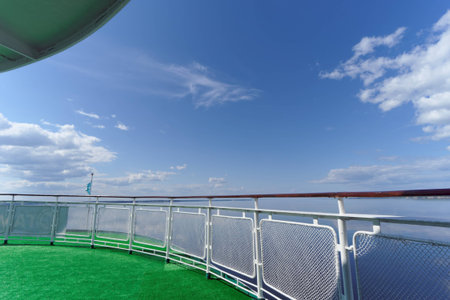 The view from the aft deck of the ship on a beautiful blue sky with clouds and the wide river,...