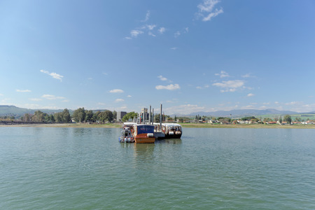 Israel. - February 17.2017. Pier on the shore of the Sea of Galilee. Several pleasure crafts were pinned to the pier.のeditorial素材