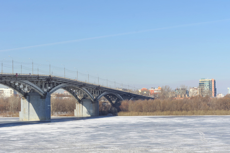 Nizhny Novgorod, Russia. - March 14.2017. Kanavinsky Bridge over the Oka River. View from the high bank side. Spring melting ice will soon open and an ice drift will begin.のeditorial素材