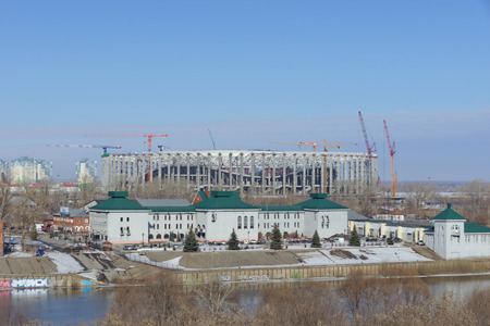 Nizhny Novgorod, Russia. - March 14.2017. Regional administration of the State Traffic Safety Inspectorate on the bank of the river Oka. Behind is the construction of a football stadium for the 2018 World Cup.のeditorial素材