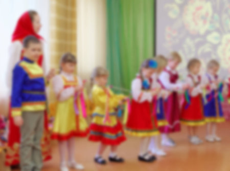 Folk dances of children theme abstract blur background with bokeh effect.の写真素材