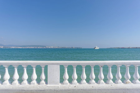 View on the Gelendzhik bay from embankment. White fence and a sea of wonderful colors.