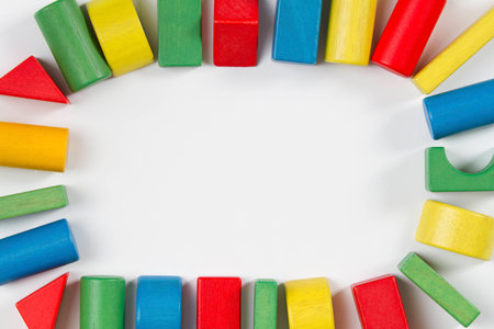 Toys blocks frame, multicolor wooden building bricks, group of colorful game pieces