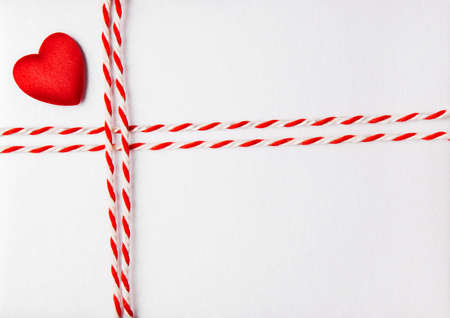 Red Heart Valentine Day Background, Wedding Invitation Card Envelope with Ribbon, Rope Tied Bow Knot. Love Greeting Mail Concept.の写真素材