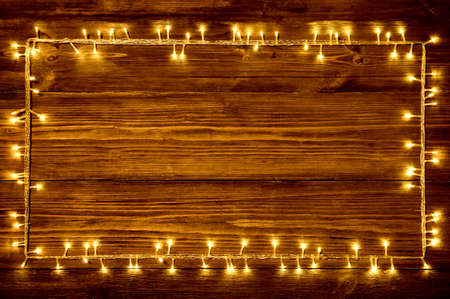 Garland Lights on Wood Background, Holiday Wooden Frame, Dark Brown Rustic Planksの写真素材