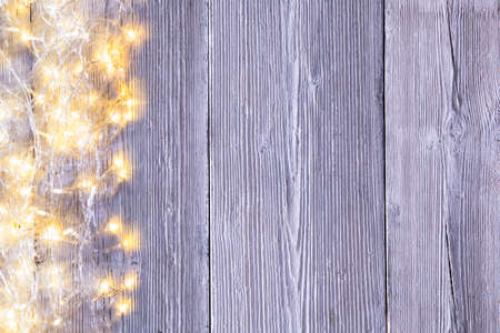 Garland Lights Wood Background, Wooden Board Texture with Holiday Lightの写真素材