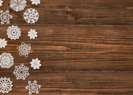 Snowflakes Wood Background, Christmas Snow Flake Lace Decoration, Snowflake on Wooden Planksの写真素材