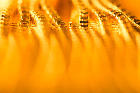 Abstract Gold Background, Blurred De Focused Golden Chain, Yellow Metal Chains Shallow Depth of Fieldの写真素材