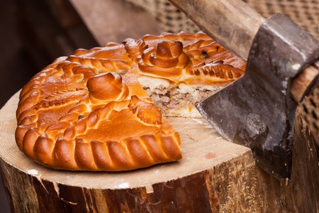 Pie on the table with food set on wooden backgroundの写真素材