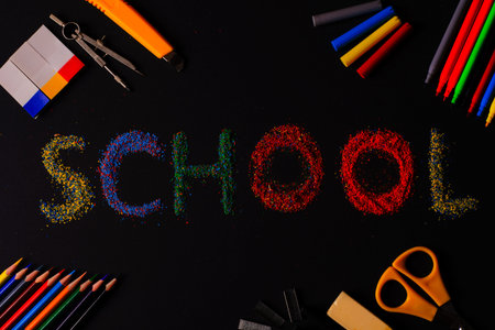 school supplies on the background of the blackboard. back to school. template with stationery