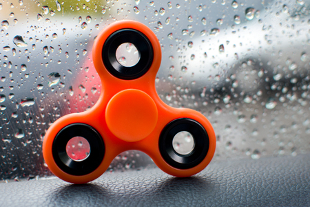 Spinner in the background of a car windowの写真素材