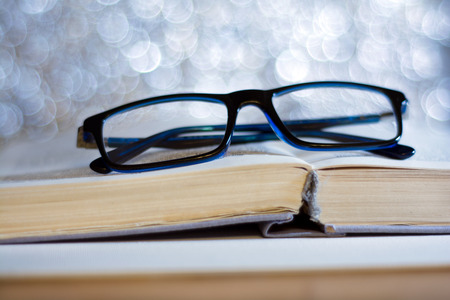 blue glasses and bookの写真素材