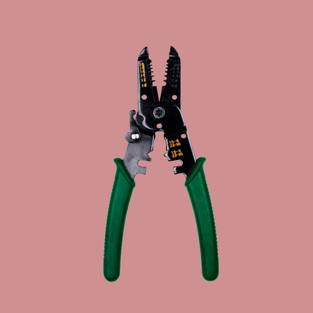 wire stripper on a pink backgroundの写真素材
