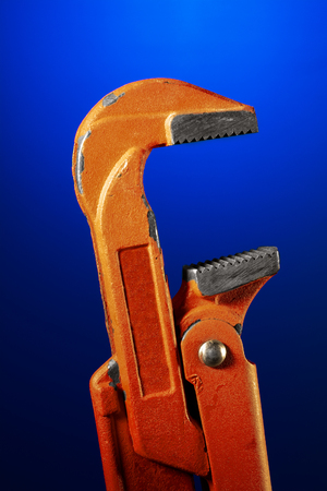 Sanitary wrench on a blue background macroの写真素材