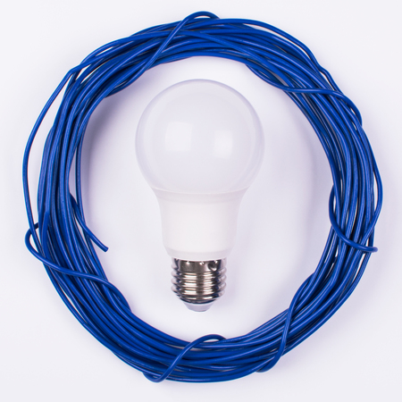 blue roll of electrical wires with light bulbの写真素材