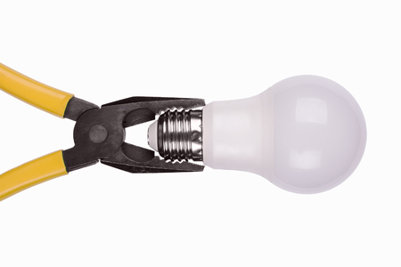 yellow pliers tighten energy-saving light bulbの写真素材