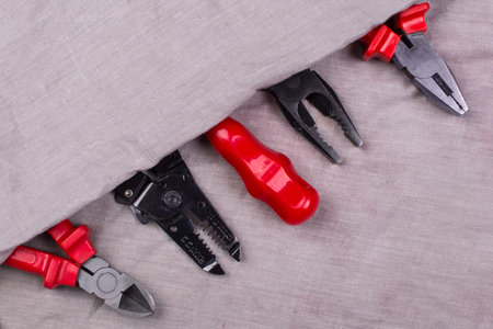 the electrician's tool lies in a row