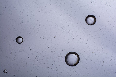 air bubbles in the water. abstract light gray backgroundの写真素材