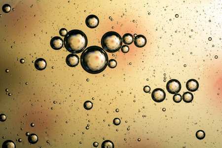 yellow orange concept of oil bubbles on the water