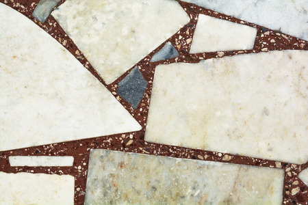 abstract background and texture on the floor mosaic in red tonesの写真素材