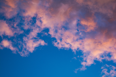 combination of pink and blue tones in the sky at sunsetの写真素材