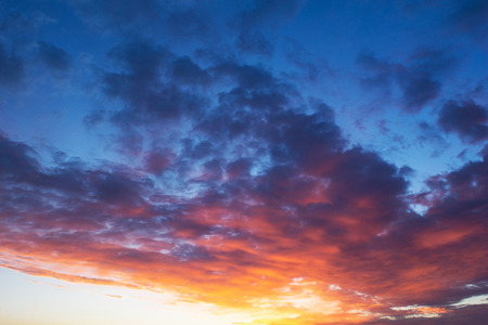 dramatic sunset in the sky. combination of cold and warm shadesの写真素材