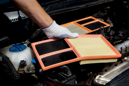 replacing engine air filterの写真素材