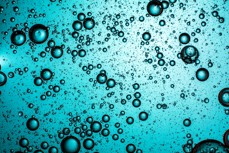 turquoise background of air bubblesの写真素材
