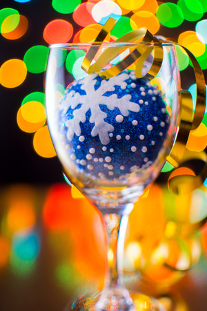 blue christmas ball with snowflake inside a glassの写真素材