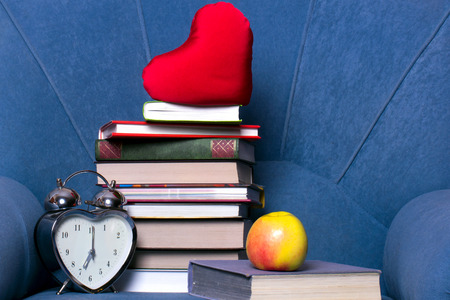a stack of books on a armchairの写真素材