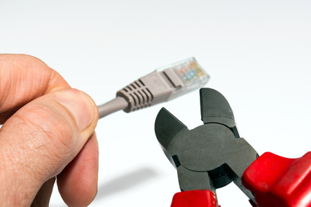 Cutters cut off the network wires of the Internetの写真素材