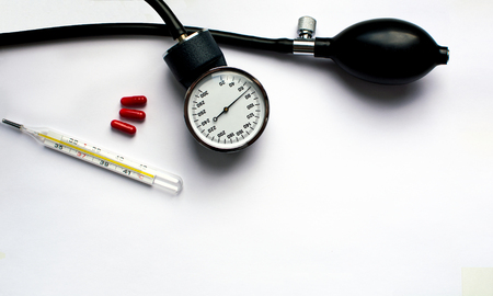 Blood pressure meter and stethoscope isolated on whiteの写真素材