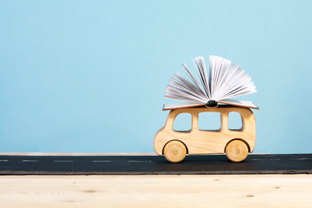 back to school. children's bus carrying a book