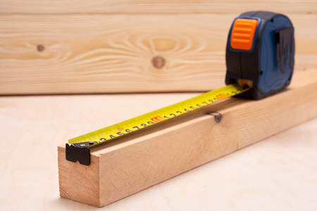 Measuring tape measure on the boardの写真素材