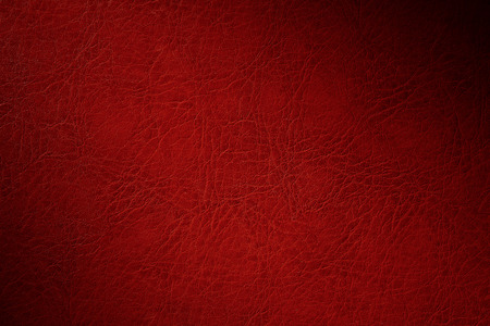 texture of red natural leather closeup with dimmingの写真素材