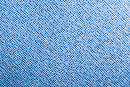 background or texture of blue natural leather closeup