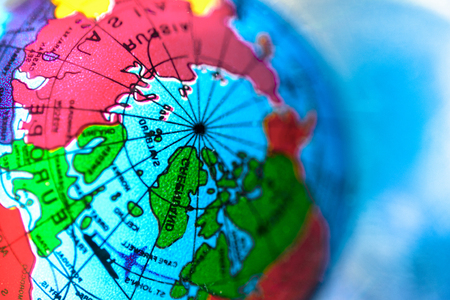 colorful bright globe on a blue abstract backgroundの写真素材