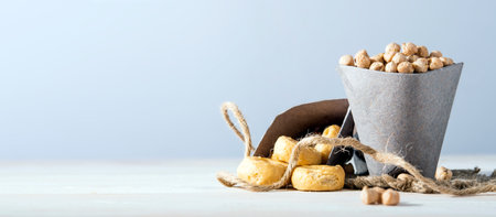 Paper sack with chickpeas on a wooden table.の写真素材