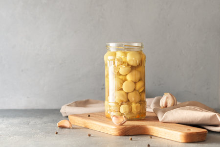 Canned champignons on a concrete background with a copy of space. Fermented products.の写真素材