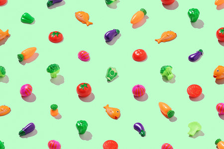 Concept of a healthy lifestyle. Vegetarian food pattern on a light green background.