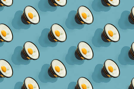 A repeating egg-shaped speaker on a blue background. Seamless pattern.の写真素材