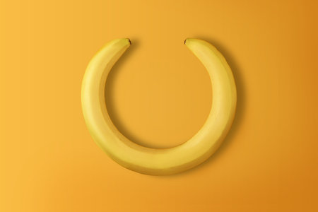 Creative banana wreath on yellow background with copy space. Top view.の写真素材