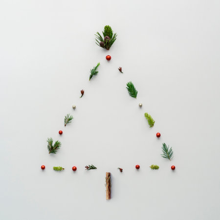 Christmas tree in the shape of a triangle on a white background. Creative Christmas tree layout.の写真素材
