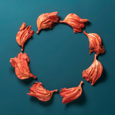 Creative wreath of crumpled Asian flowers on a dark blue background.の写真素材